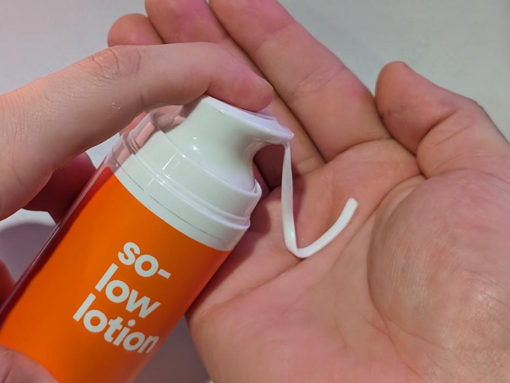 So-Low lotion on a hand