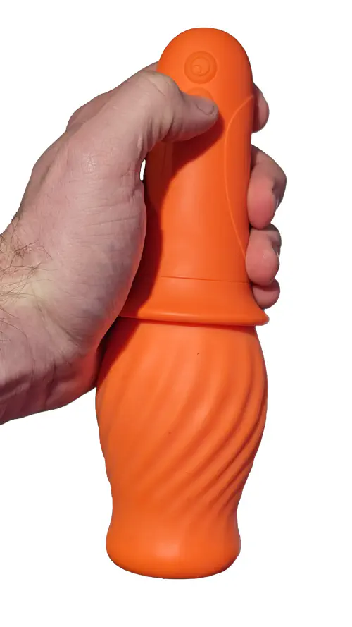 Cake Spin Stroker held in a hand