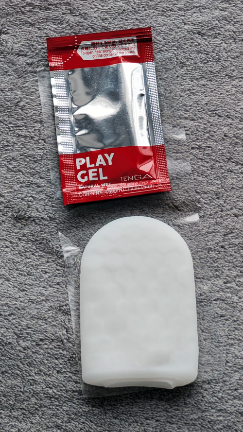 Contents of the package include the stroker and a sachet of lube